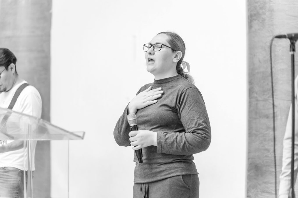 pexels photo 23015797 23015797 Black and white photo of a woman singing emotionally indoors in Ciudad de México.